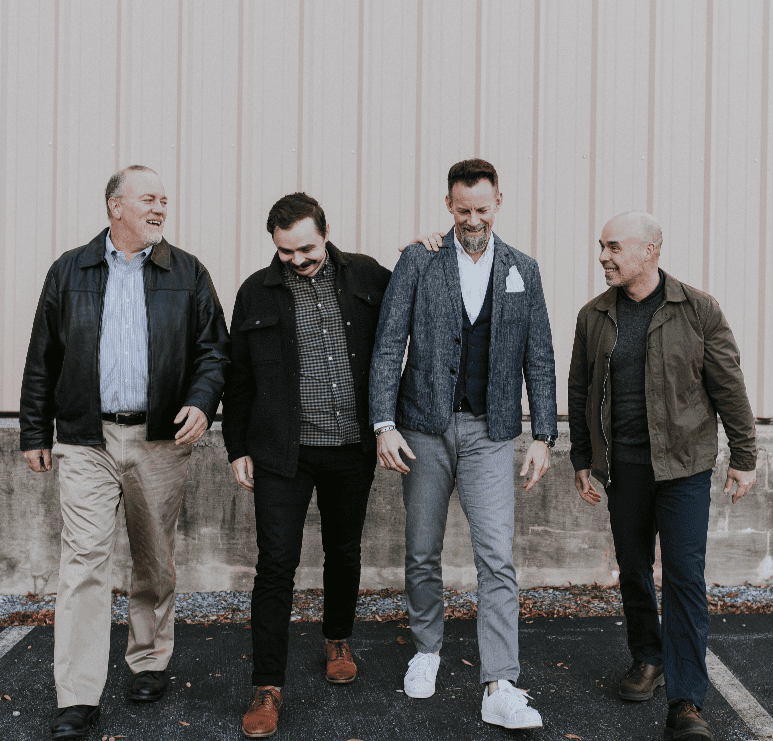 coaching image Four men with balanced hormones standing together