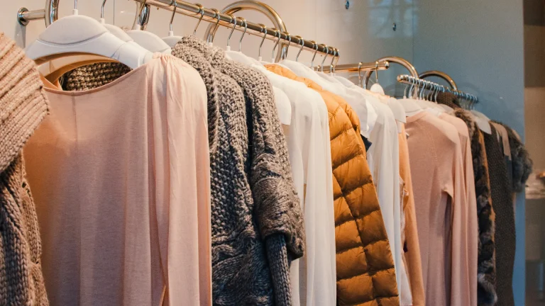 Cotton vs synthetic fabric - women's clothing rack inside of a store