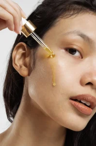 women putting sesame oil on her skin for winter 