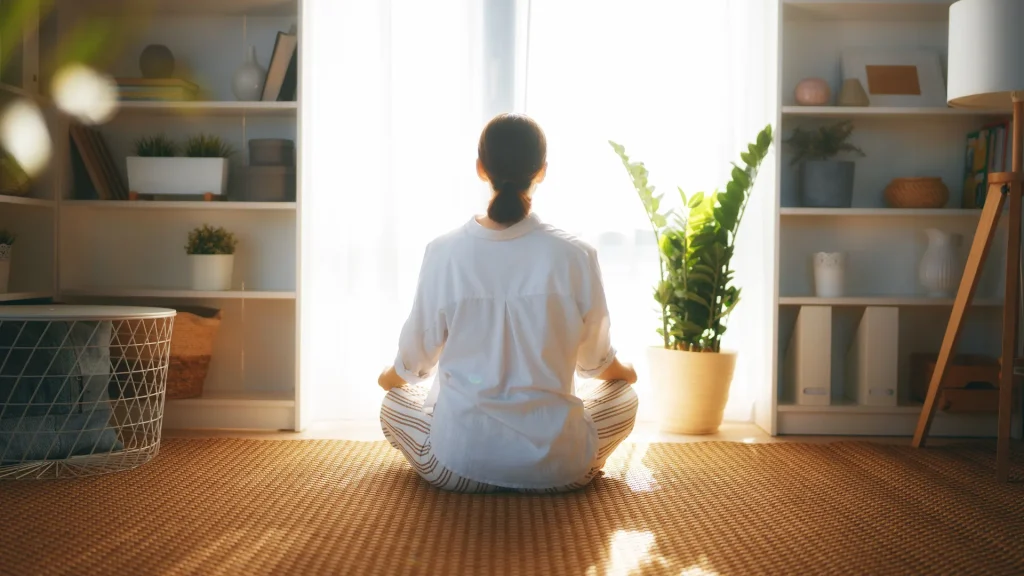 Woman learning how to handle a breakup through meditation