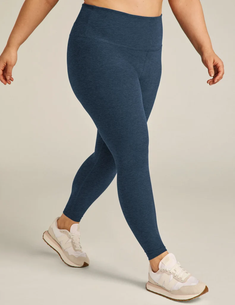 Woman wearing the Beyond Yoga Midi Leggings