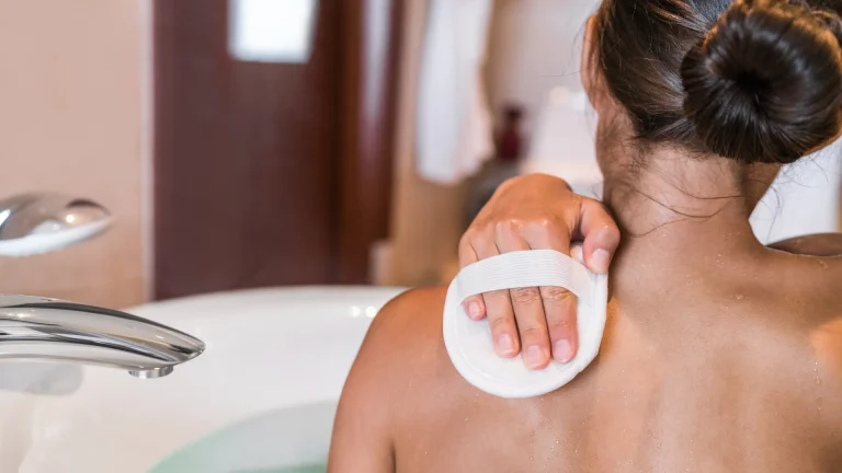 Natural Ways To Exfoliate - Woman exfoliating her skin